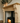Solid pine fire surround showing corbel-detailed uprights and mantel shelf, natural wax finish, handmade in Yorkshire