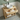 Open drawer on the wooden vanity unit showing the cut-out for basin waste and pipework