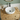 Top-down view of the wooden vanity unit showing the solid wood worktop and drawer layout