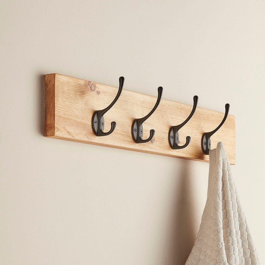 Rustic oak coat hanger with wall-mounted hooks